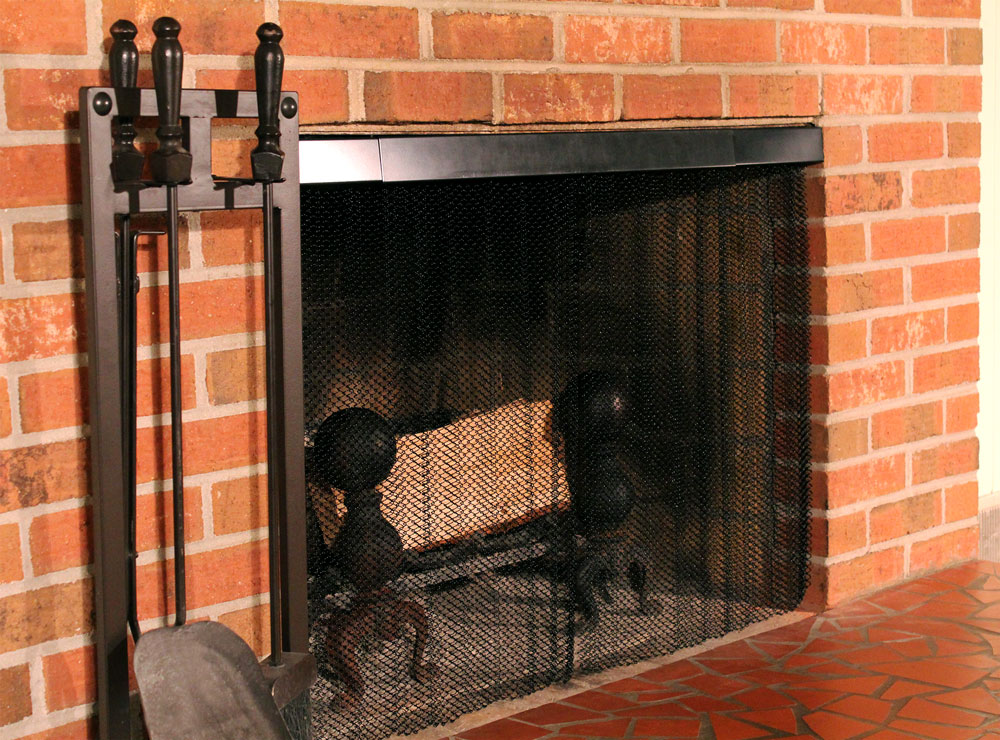 Condar black rod and valance and hanging screen installed in fireplace