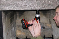 Drill two pilot holes on the two pencil marks using a 3/16 inch masonry drill bit.