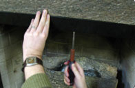 Align valance back in the center of your firebox and secure the two center holes with tapcom screws.